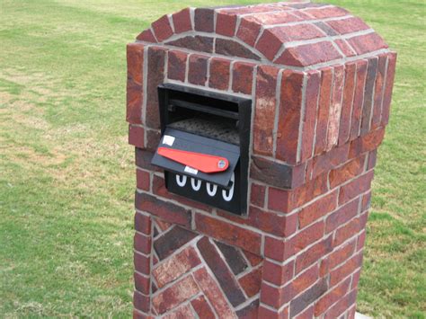 metal box in brick mailbox|mailbox mounted in brick.